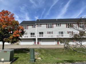 Back side with decks and garages